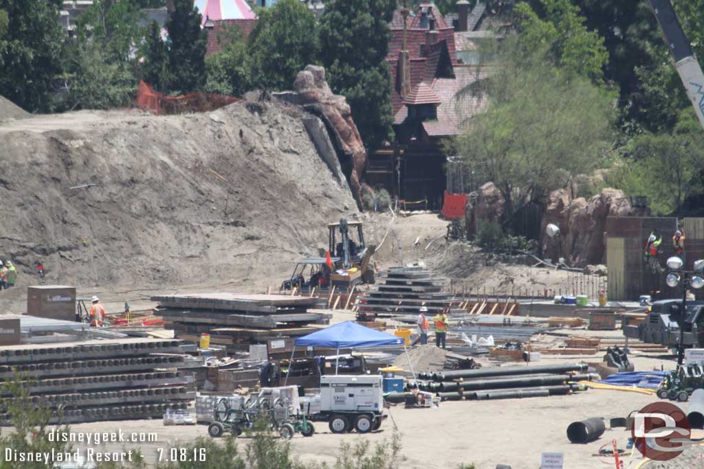 7.08.16 - In the back of this picture you can see footers for the wall extending toward the Fantasyland gate.  The wall along the Big Thunder trail is taking shape.   Hopefully this will progress quickly and the trail can re-open.  It would help with flow through the park.