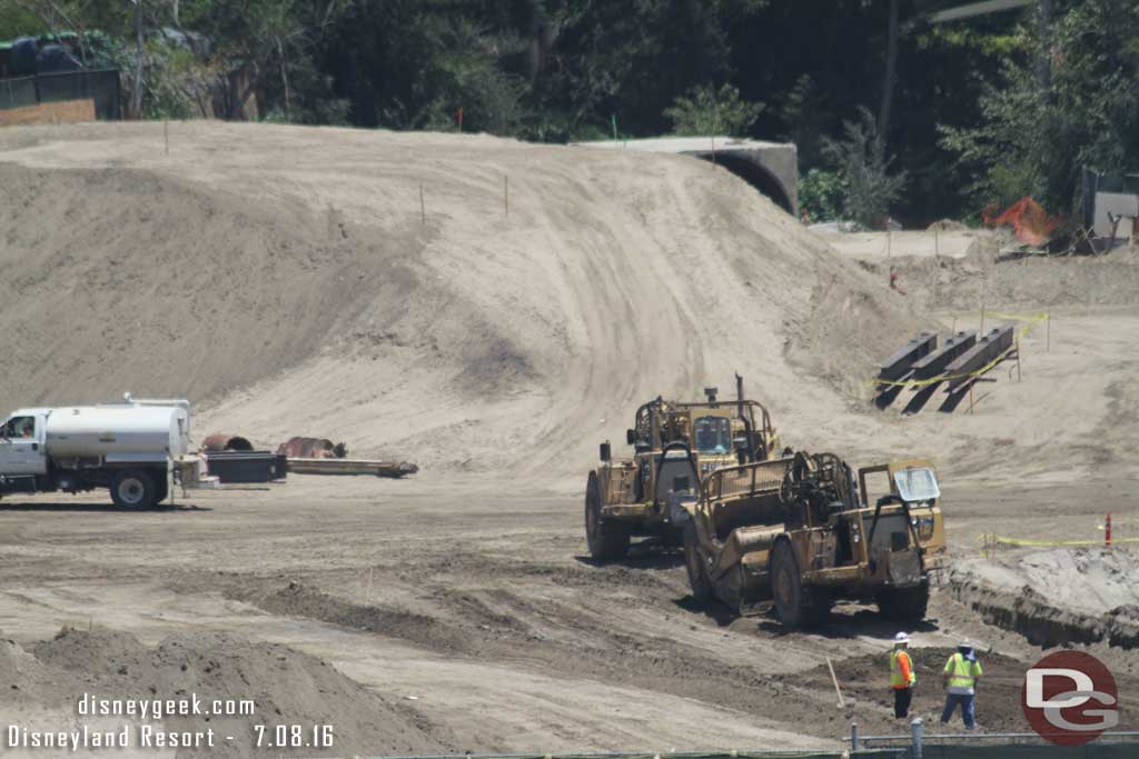 7.08.16 - There were two earth movers in action Friday.  They were taking dirt from near the big mound and bringing it to fill in a pit in the nearest area.