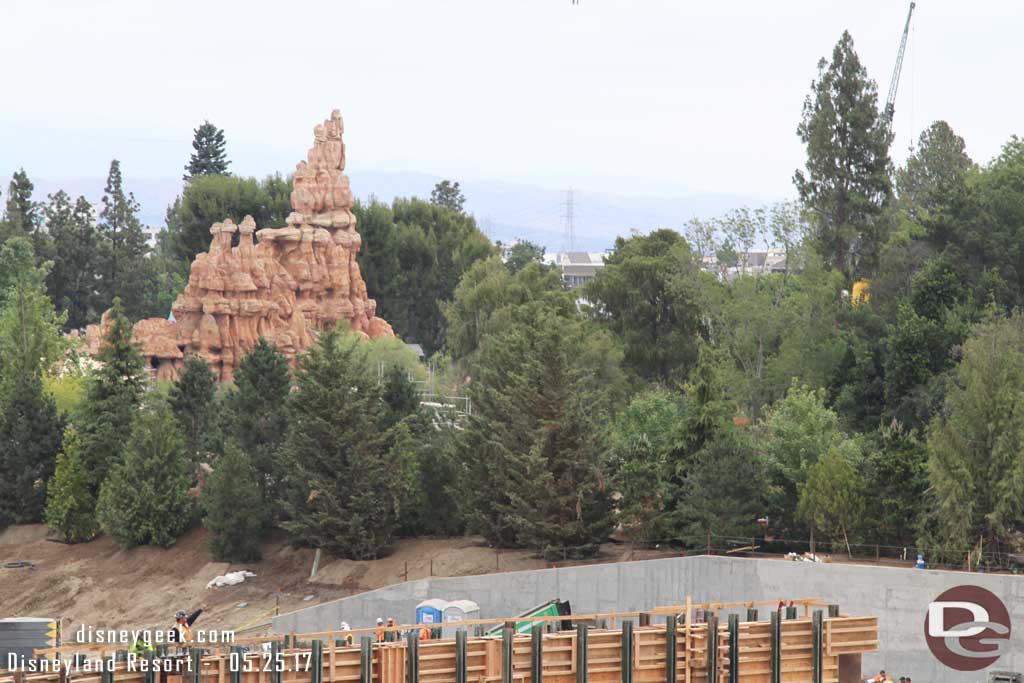 5.25.17 - The crane through the trees is in Frontierland parked at the exit to Big Thunder.