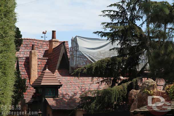 Work continues on the safety rails along the roofs of Fantasyland/