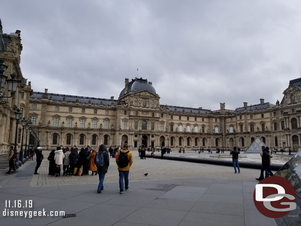 Walking into the courtyard that houses the Pyramide du Louvre 