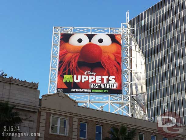 A Muppets billboard nearby.