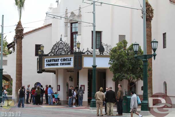 05.25.12 - A group of Imagineers gathered out front of the Carthay (on the left in this shot) and some reporters met them.