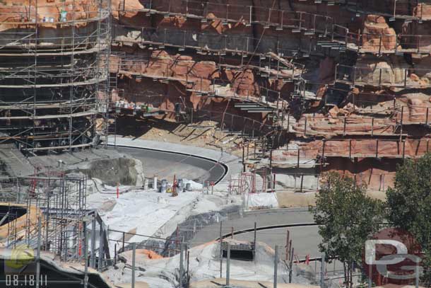 08.18.11 - They are working on finishing up the rockwork along the track since ride testing starts soon.