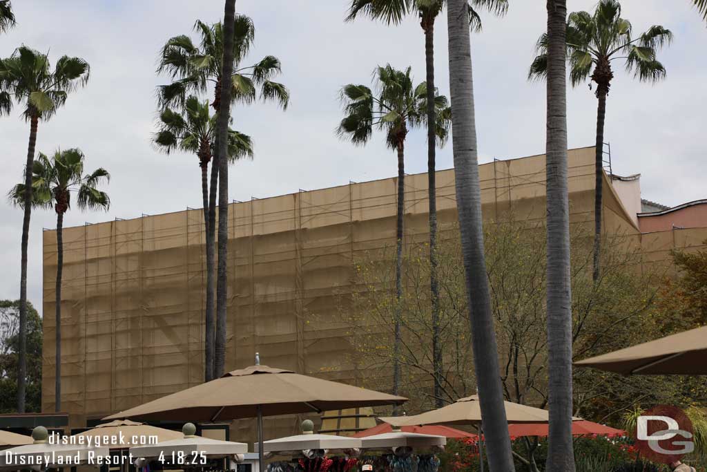 4.18.25 - Scaffolding and a scrim up blocking the Tortilla Jo's demolition from Disneyland Drive.  You can see through that the building exterior is gone and just steel remains