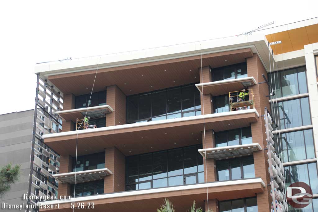 05.26.23 - Teams working to install the paneling on the overhangs of the Grand Villas