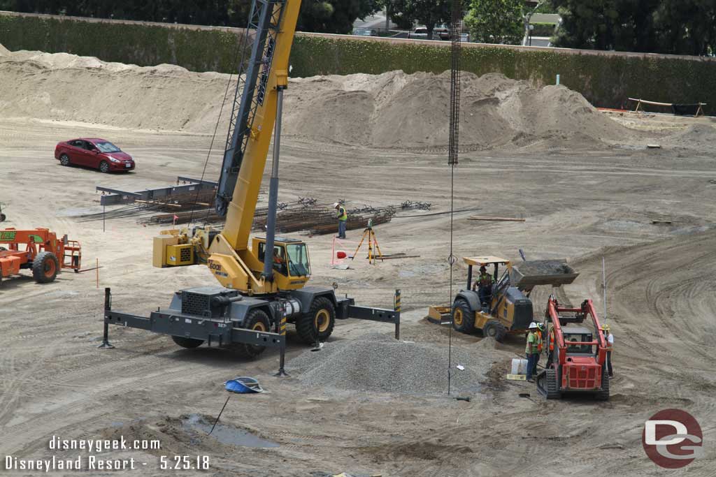 05.25.18 - Here they are preparing to lower a rebar column into a recently dug hole.