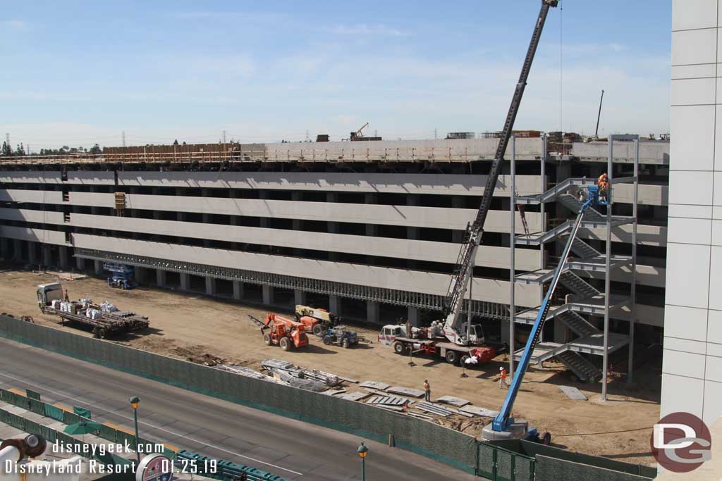 01.25.19 - On the right a crew is erecting a stair case.