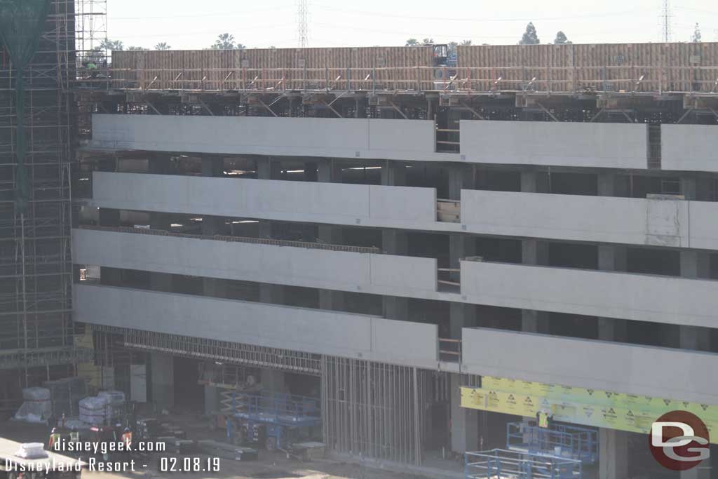 02.08.19 - Panning to the right, on ground level some framing is being installed.  On the roof the forms for the top level are still up.