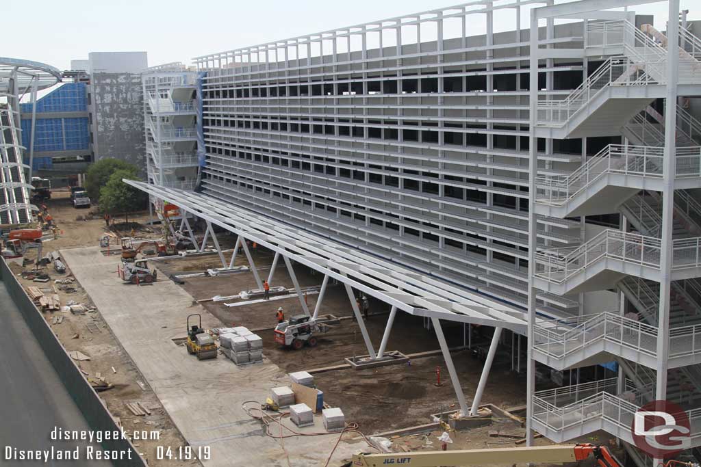 04.19.19 - Here you can see curbs and dividers are in under the awning.  These look to be the future security queues.