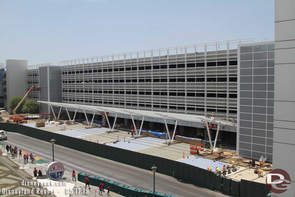 05.17.19 - The shade structure for the bag check queues is receiving its roof.