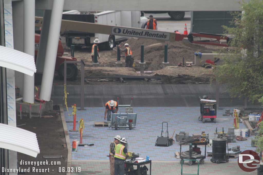 06.03.19 - Pavers installed to the tram way.  Looks like gates going in along the tram way and security poles on the far side. 