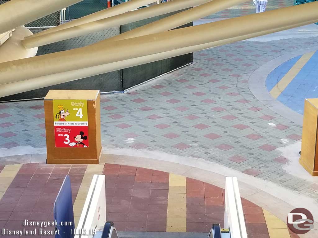10.03.19 - The signs have been removed from the escalators.  Guessing signage to match the Pixar Pals structure is coming.