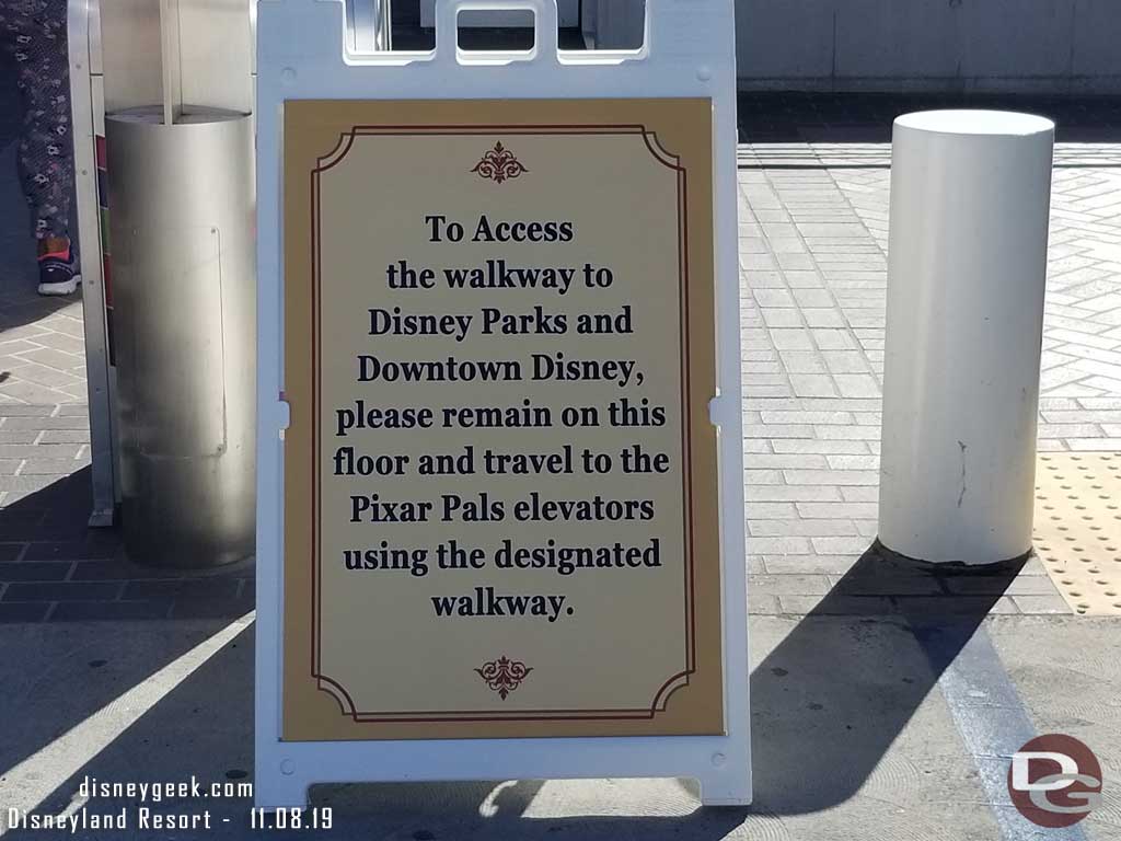 11.08.19 - A sign by the elevators directing those who walk over to the Pixar Pal structure elevators to the bridge.