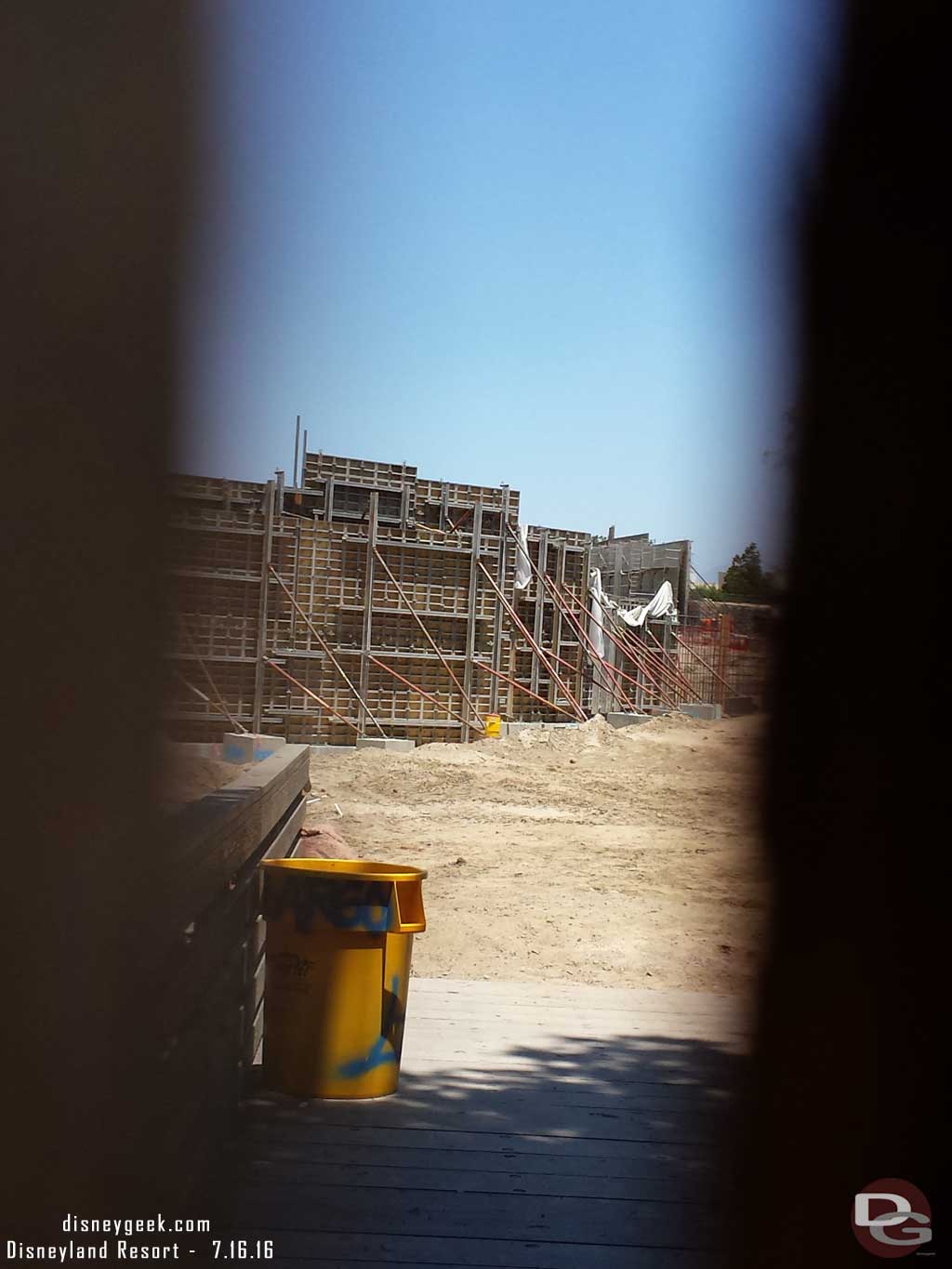 7.16.16 - A look through the fence at the new walls going up.