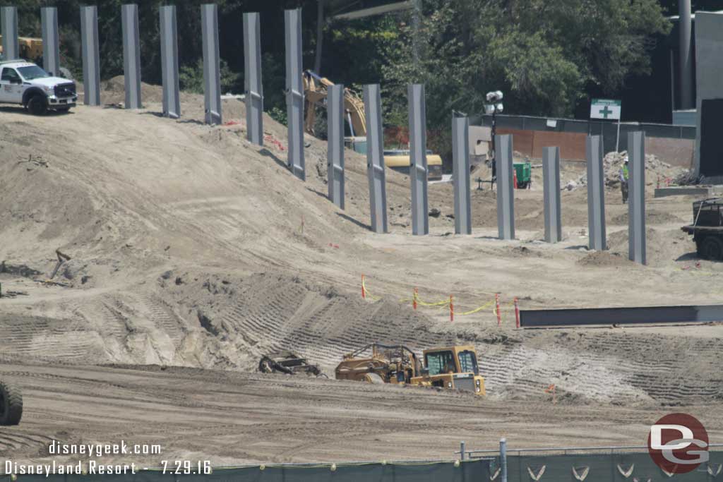 7.29.16 - An earth mover driving through the trench and removing dirt.