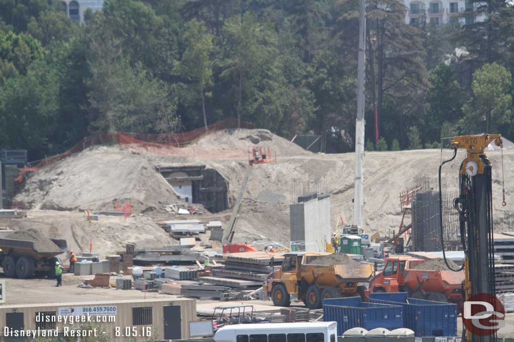 8.05.16 - Dump trucks moving dirt around the site.  Also notice more columns and sections of wall taking shape.