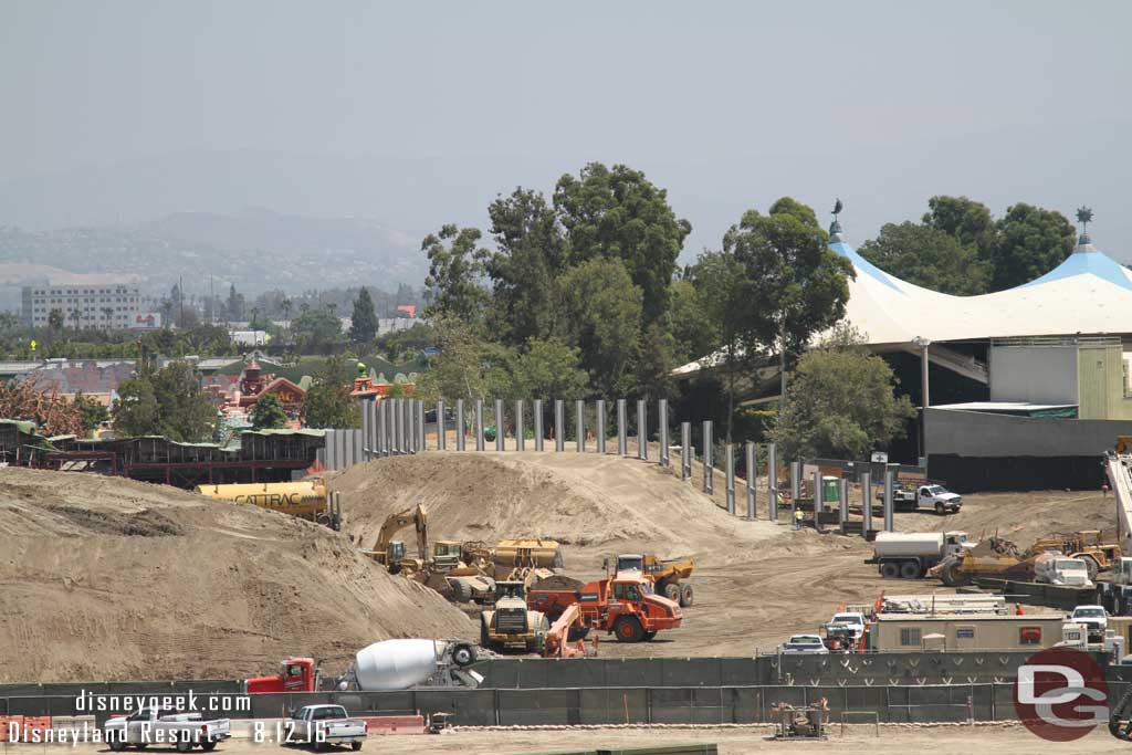 8.12.16 - Panning to the right.  They have started to slide wood in between the steel i-beams on ther right for what looks to be a retaining wall.