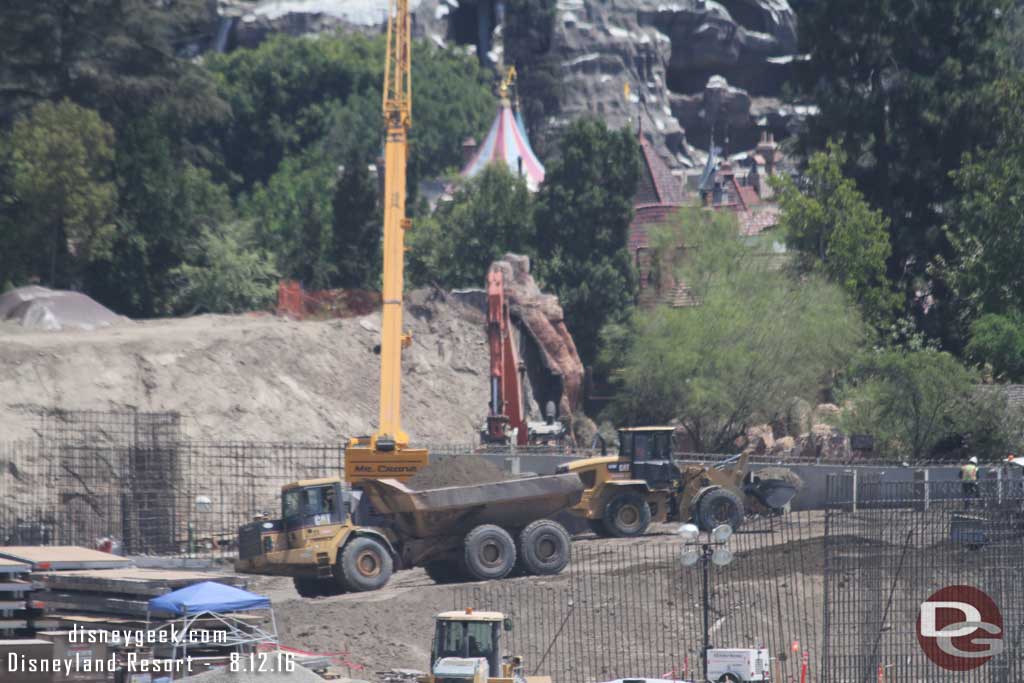 8.12.16 - Here you can see a truck delivering a load of dirt from the mound as they build up behind the wall along the Big Thunder Trail.