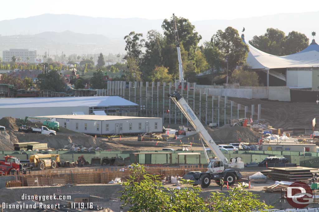 11.19.16 - Panning to the right across the site, the new backstage building has extended toward the retaining wall.