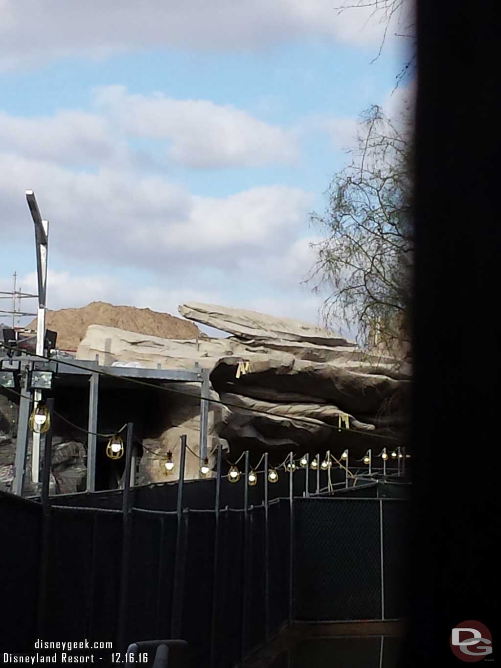 12.16.16 - Looking through the fence.  Looks like a temporary walkway is set up along the Big Thunder Trail.