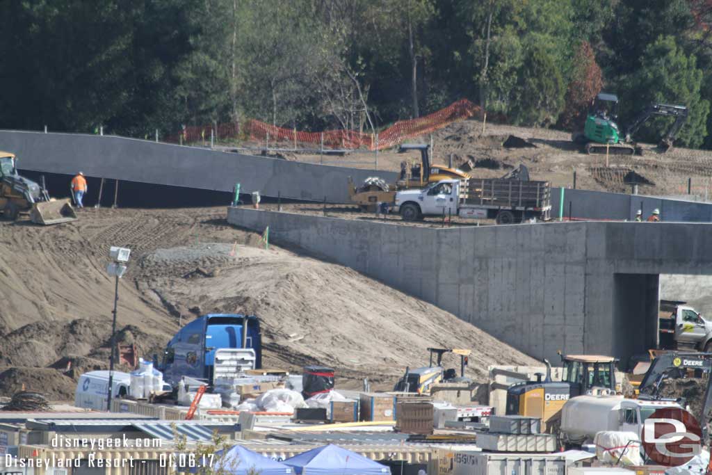 1.06.17 - The dirt is being brought in and leveled off for the train right of way.  The truck and equipment are on it.  Looks like the small machine in the background is working on new holes too.
