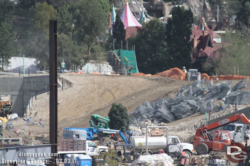 3.03.17 - Wire mesh that will be rocks is staged on the hill between the two entrances.  In the distance work on the wall facing the Big Thunder trail near Fantasyland.