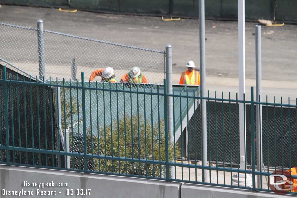 3.03.17 - Crews working on the fencing and backstage entrance by the tram route.