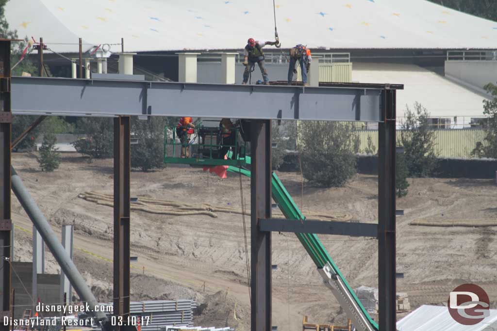 3.10.17 - Crews attaching a beam on the roof.