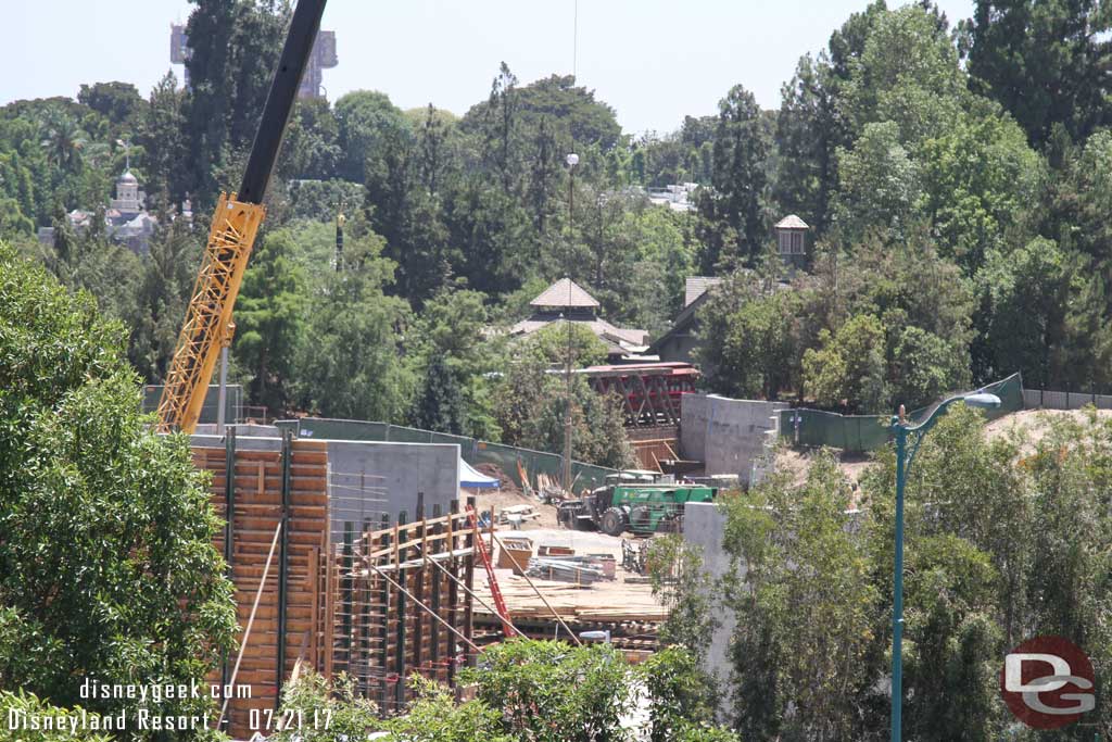 7.21.17 - A train passing over the tresle.  Notice the wall up under the trestle as they prepare to open the rest of the park side walkway.