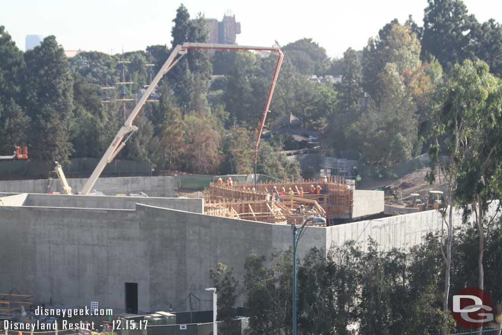 12.15.17 - A crew pouring concrete into the forms toward Critter Country.