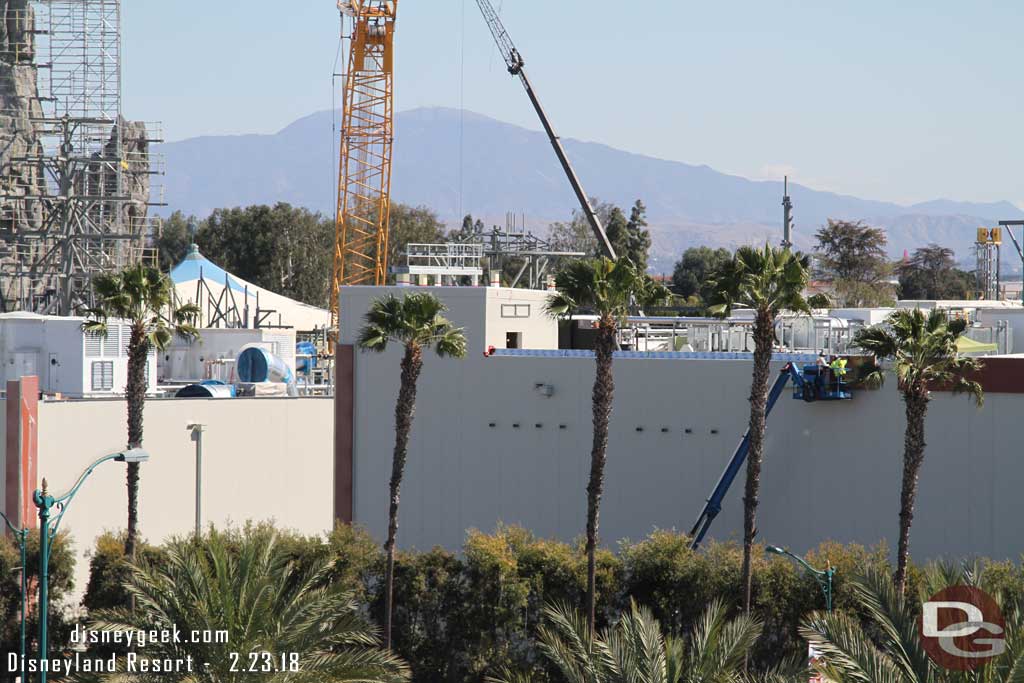 02.23.18 - A team is working its way across the top of the Battle Escape show building that parallels Disneyland Drive.