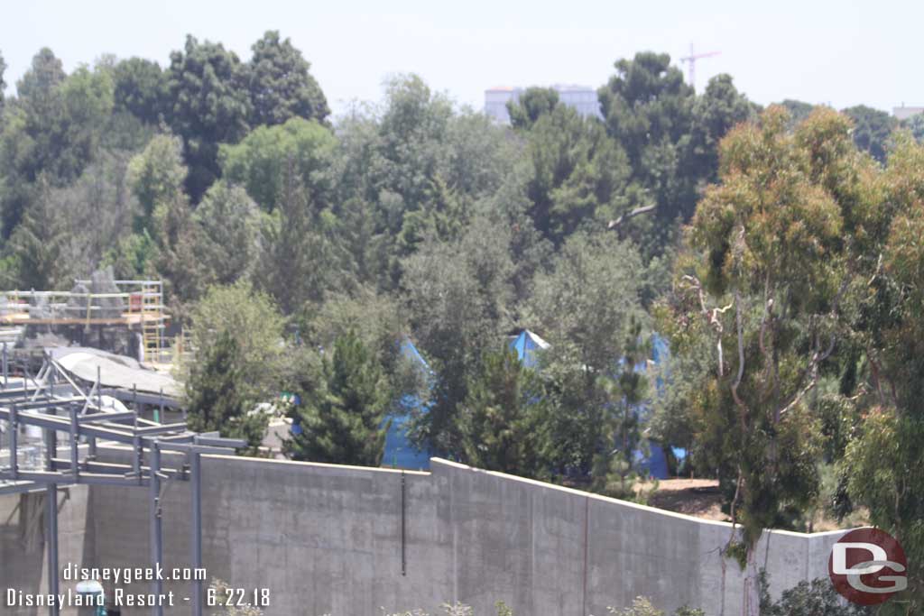 06.22.18 - The blue tarp is still visible through the trees.