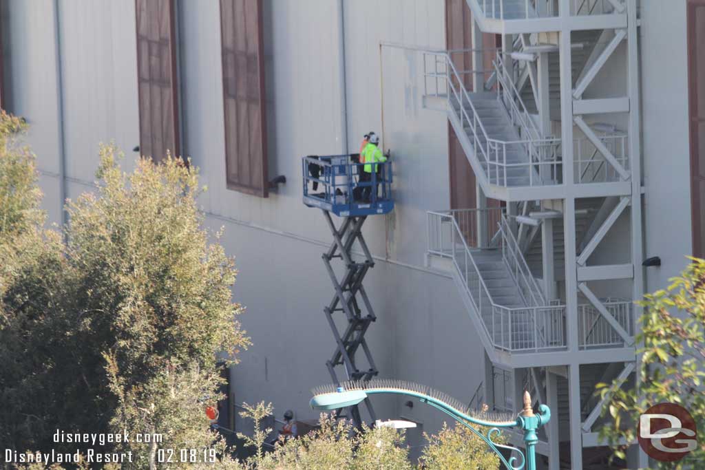 02.08.19 - A team working on the former opening in the building facing Disneyland Drive.