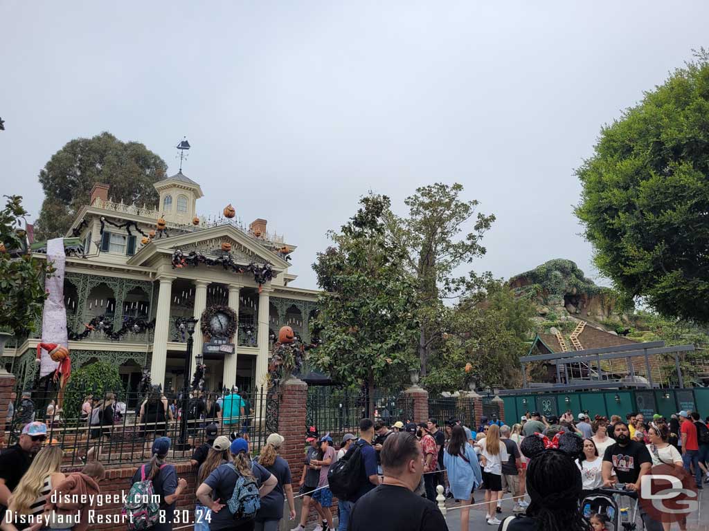 8.30.24 - From ground level. The new Haunted Mansion gift shop is taking shape.