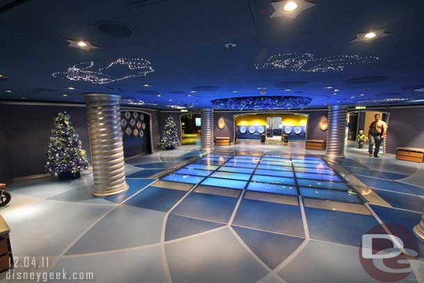 The central space features a large interactive floor and then several rooms that spawn off of it.  Also notice the Christmas trees and other decorations.