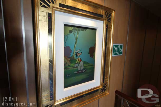 Inside a piece of enchanted art.  When you walked up Goofy would take a swing.