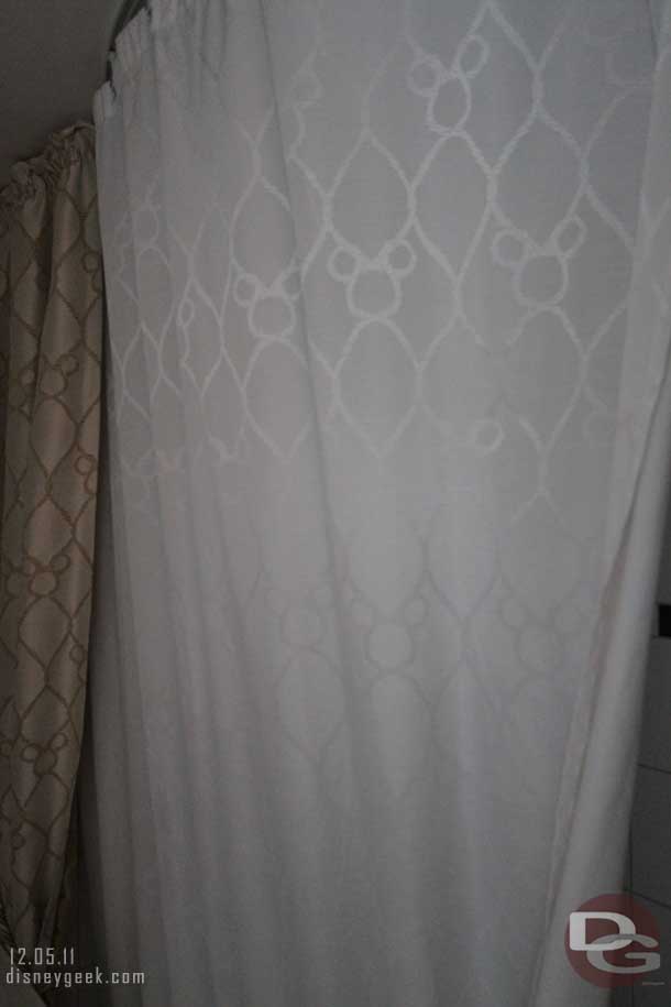 The shower curtain.