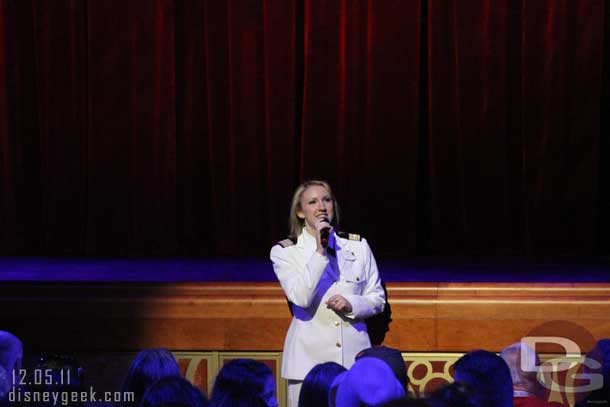 I missed her name.. believe she is the assistant cruise director.  She came out to introduce the cruise director.