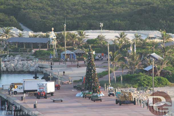 Cast members moving equipment into position as we approach.