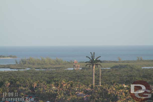 The observation tower on the far side of the island and the abnormally large palm tree in the middle (it is a communication tower).