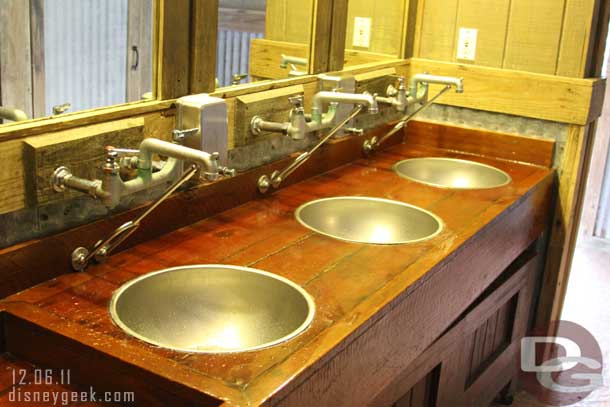 The sinks in the mens room.