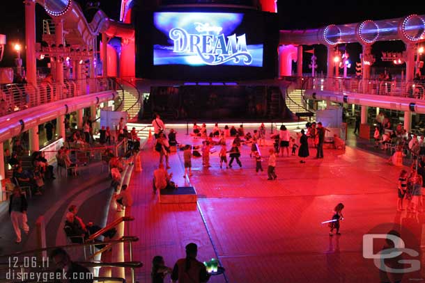 While waiting for the show to begin Kids took over the floor (the pools on deck 11 were covered for the event).  It was great watching them sword fight.. pirate sword against light saber.. gun again sword.  You name it they were swinging it at each other!