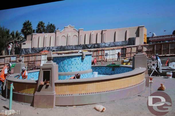 The current state.  They said once finished the walls will be pushed back to allow for traffic to go through but the fountain will be screened off until the street opens next year.