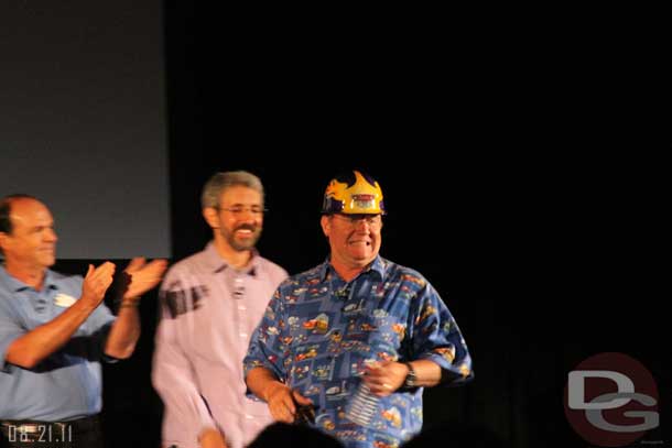 The panel taking the stage and John Lasseter sporting the custom hard hard for the project.