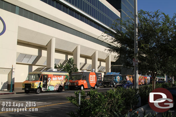 Food trucks lining up awaiting to move into position.