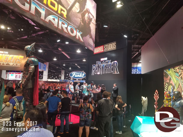 Some of the cast of the Black Panther signing autographs at the Marvel area.