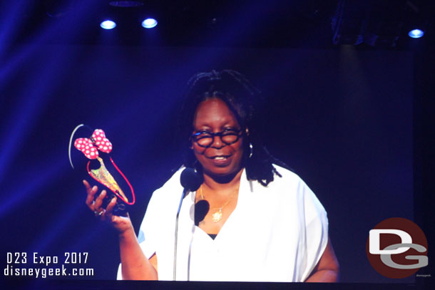 Whoopie showing off her Minnie Mouse shoes.