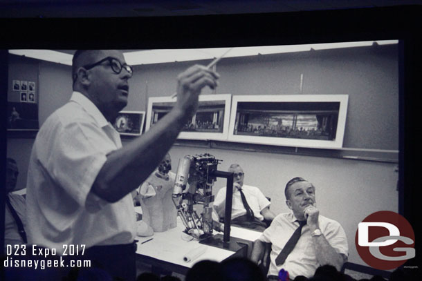 Bob Gurr explaining something.