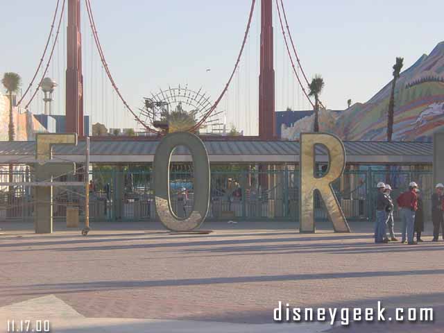 A Gold cover is being put on all the letters at the DCA entrance.